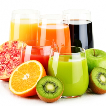 Composition with glasses of assorted fruit juices isolated on white. Detox diet
